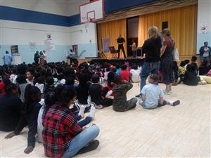 students watch a performer